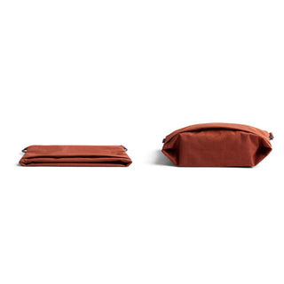 Bellroy Lite Sacoche in rust color shown flat and expanded with smooth recycled fabric texture