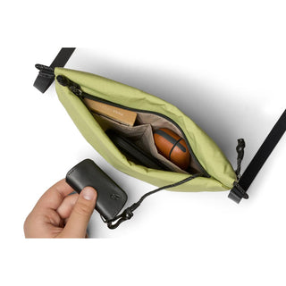 Bellroy Lite Sacoche in light green with compact storage and durable recycled fabric design