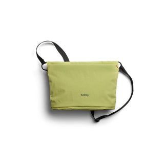 Bellroy Lite Sacoche in light green recycled fabric with adjustable black strap and compact design