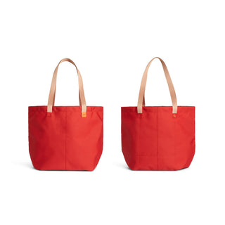 Bellroy Market Tote in vibrant red with natural tan handles shown from front and back angles