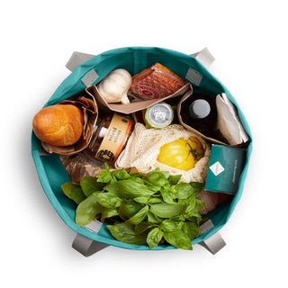 Bellroy Market Tote filled with groceries showing durable recycled nylon and multiple compartments
