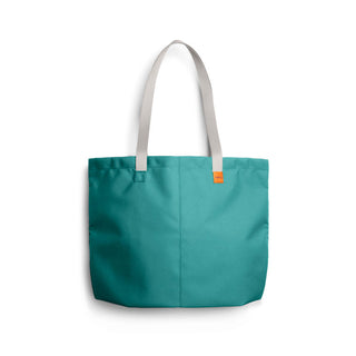 Bellroy Market Tote in teal recycled nylon with beige straps and a small orange brand tag