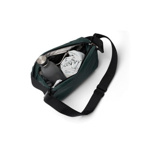 Bellroy Venture Sling 6L in dark green with adjustable strap and organized interior compartments