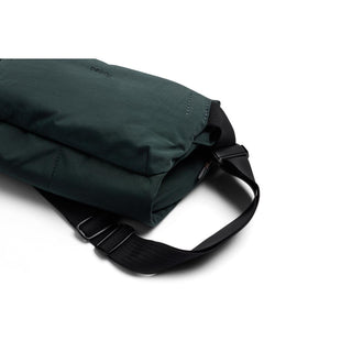 Bellroy Venture Sling 6L in dark green recycled fabric with adjustable black strap on white background