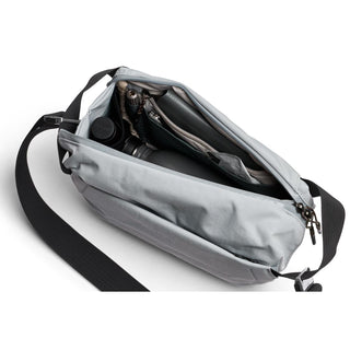 Bellroy Venture Sling 6L in light gray showing organized interior compartments and black adjustable strap