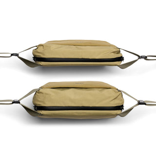 Bellroy Venture Sling 6L in tan recycled nylon fabric shown from side with zipper details and adjustable straps