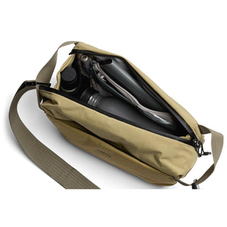 Bellroy Venture Sling 6L in tan with organized compartments and adjustable shoulder strap