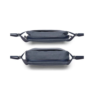 Bellroy Venture Sling 6L in navy fabric showing slim, compact profile from top and side views