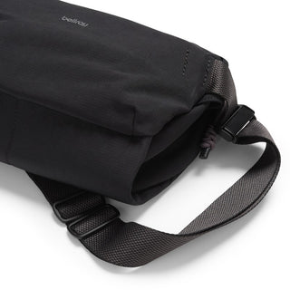 Black Bellroy Venture Sling 6L made of textured fabric with adjustable strap and buckle detail close up