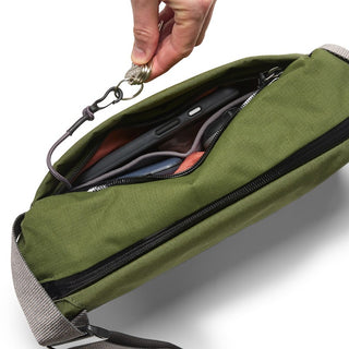 Bellroy Venture Sling 6L in green fabric with key clip and organized interior compartments visible