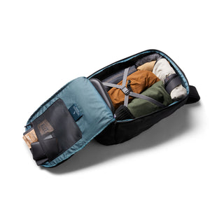 Bellroy Transit Workpack Pro 22L unzipped with organized clothes packed inside showing interior storage features