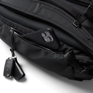 Bellroy Transit Workpack Pro 22L close-up of black front zippered pocket holding a smartphone and key fob