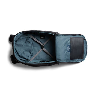 Bellroy Transit Workpack Pro 22L open showing spacious interior with adjustable cross straps and mesh pocket inside flap