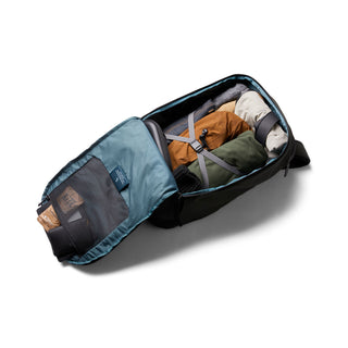 Bellroy Transit Workpack Pro 22L open showing organized interior with packed clothes and blue lining