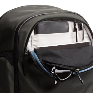 Bellroy Transit Workpack Pro 22L in dark green showing front organizer pocket with pens and notebook