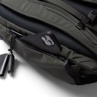 Bellroy Transit Workpack Pro 22L in dark green with zippered pocket holding a smartphone securely