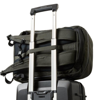 Bellroy Transit Workpack Pro 22L backpack strapped on suitcase handle with padded recycled fabric straps visible