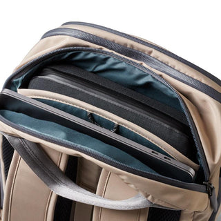 Bellroy Transit Workpack Pro 22L open showing padded laptop compartment and beige recycled fabric exterior