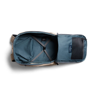 Bellroy Transit Workpack Pro 22L open tan backpack showing spacious blue interior and organizing straps