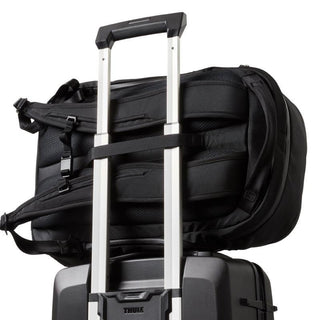 Bellroy Transit Workpack Pro 28L secured on suitcase handle with padded back and straps visible