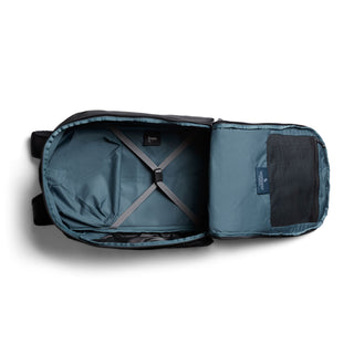 Bellroy Transit Workpack Pro 28L open interior showing blue fabric and adjustable cross straps for secure packing