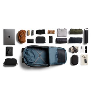 Bellroy Transit Workpack Pro 28L open bag with organized tech and travel essentials laid out flat