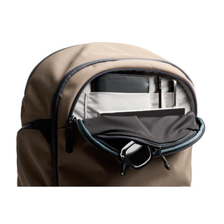 Bellroy Transit Workpack Pro 28L in beige with organized front pocket holding pens and accessories