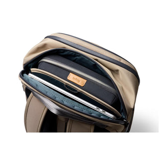 Bellroy Transit Workpack Pro 28L showing organized interior with laptop compartment and beige recycled fabric exterior