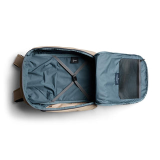 Bellroy Transit Workpack Pro 28L open interior showing blue recycled fabric and secure straps inside backpack