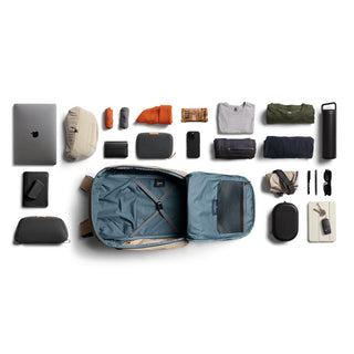 Bellroy Transit Workpack Pro 28L open light blue interior surrounded by organized travel essentials