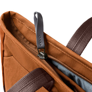 Bellroy Tokyo Tote Compact close-up of brown woven fabric and leather zipper pull detail