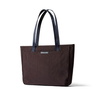 Bellroy Tokyo Tote Compact in dark brown woven fabric with navy handles and sleek front label