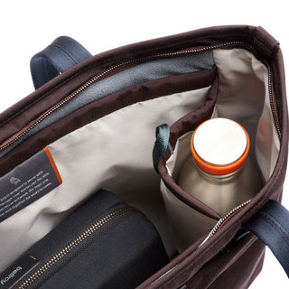Bellroy Tokyo Tote Compact showing interior organization with bottle pocket and zippered pouch in brown lining