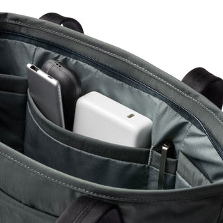 Bellroy Tokyo Tote Compact with organized interior pockets holding tech accessories and pens in woven fabric lining