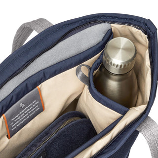 Bellroy Tokyo Tote Compact showing navy interior with organized compartments and stainless steel bottle pocket