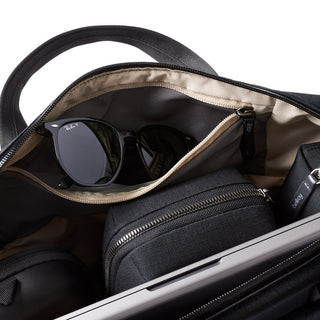 Bellroy Via Work Bag (Tech Briefcase) showing organized interior with sunglasses and tech accessories in black fabric
