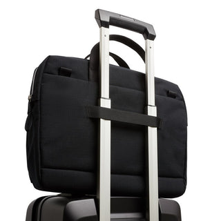 Bellroy Via Work Bag (Tech Briefcase) in black fabric attached to suitcase handle for travel convenience