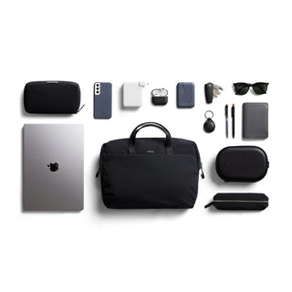 Bellroy Via Work Bag (Tech Briefcase) in black nylon with laptop and tech accessories neatly arranged around it