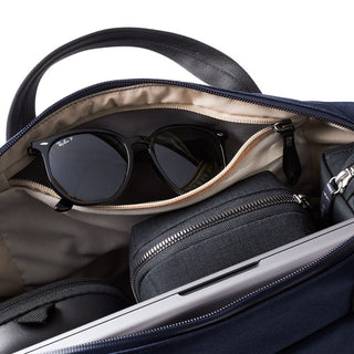 Bellroy Via Work Bag (Tech Briefcase) open showing organizer pockets with sunglasses and accessories inside