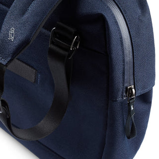 Close-up of navy textured fabric and black strap on Bellroy Via Work Bag (Tech Briefcase) with metal zipper detail