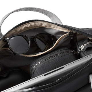 Bellroy Via Work Bag (Tech Briefcase) open showing organized interior pockets with sunglasses and accessories