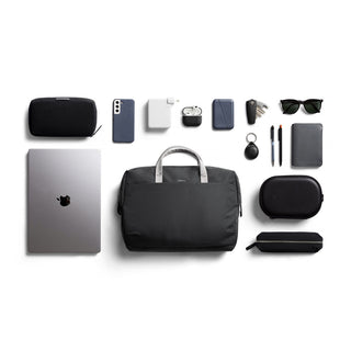 Bellroy Via Work Bag (Tech Briefcase) in black with organized tech accessories and silver handle on white background