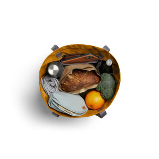 Bellroy Market Tote open top view showing groceries and recycled nylon fabric in ochre color