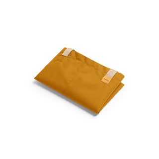 Folded mustard yellow Bellroy Market Tote made from durable recycled nylon fabric