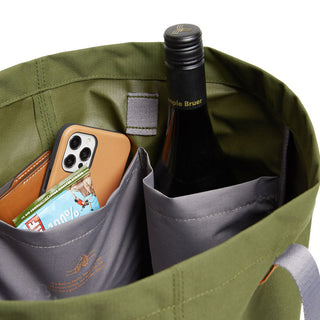 Bellroy Market Tote with olive recycled nylon fabric and interior pockets holding phone and bottle
