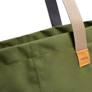 Close-up of Bellroy Market Tote in olive green featuring dual-tone handles and durable recycled nylon fabric