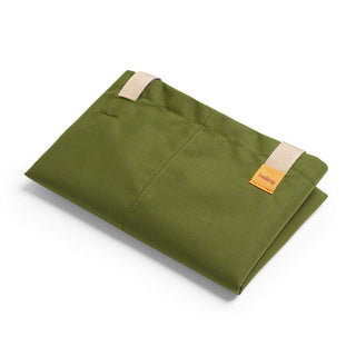 Bellroy Market Tote folded flat in olive green recycled nylon with beige strap details and logo patch