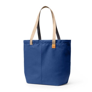 Bellroy Market Tote in navy blue recycled nylon with beige and black handles, front view on white background