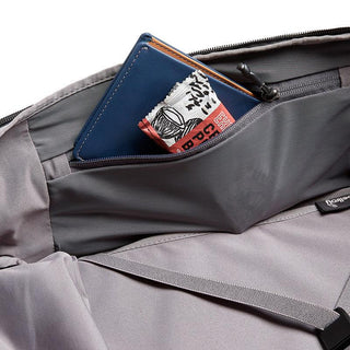 Bellroy Transit Backpack Plus interior pocket with fabric lining holding a blue wallet and small item