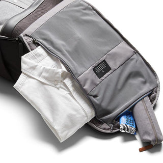Bellroy Transit Backpack Plus with open main compartment showing organized storage and folded shirt inside